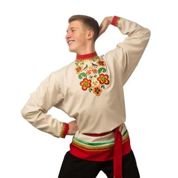Attractive russian guy dancing in folk costume isolated on white Foto stock