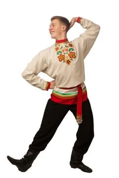 Attractive russian guy dancing in folk costume isolated on white Stock Photos