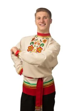Attractive russian guy dancing in folk costume isolated on white Stock Photos