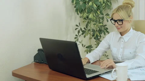 Attractive secretary working at a computer Stock Footage 43835573