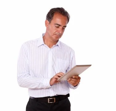 Attractive senior man using his tablet pc Stock Photos