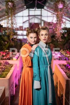 Attractive serious young women looking at you Stock Photos