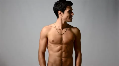 Attractive shirtless young man looking around him at copyspace Stock Footage 46036813