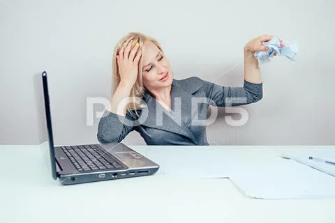 Attractive smart blonde multitasking woman business lady in stylish business Stock Photos