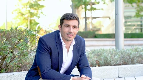 Attractive smart man looking at camera 4K video portrait Video stock 96066471