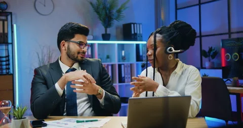 Attractive smiling successful skilled multiuethnic businessman and businesswoman Stock Footage 166694374