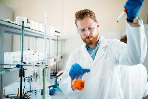 Attractive student of chemistry working in laboratory Stock Photos