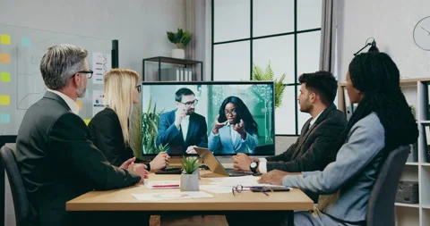 Attractive successful responsible experienced multiracial businesspeople voting Stock Footage 161021792