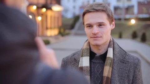 Attractive well dressed man being interviewed by a media journalist Stock Footage 73529273
