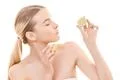 The attractive woman holding a lime on the white background Photo