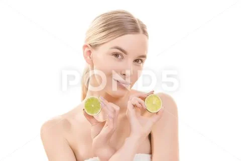 The attractive woman holding a lime on the white background Stock Photos