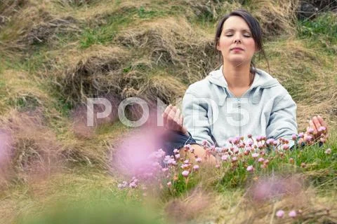 Attractive woman meditating Stock Photos