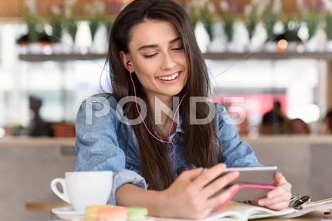 Attractive woman playing on her phone Stock Photos