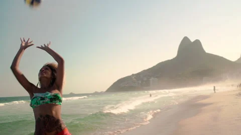 Attractive woman playing volleyball on Ipanema beach Stock Footage 59377404