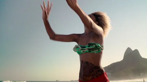 Attractive woman playing volleyball on Ipanema beach Stock Footage 59377482