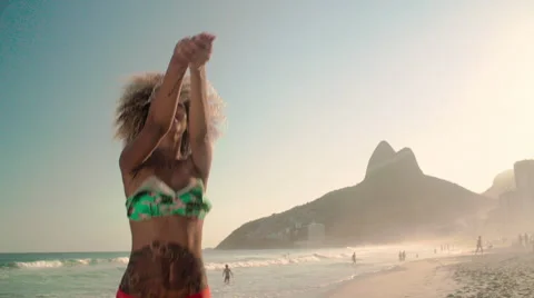 Attractive woman playing volleyball on Ipanema beach Stock Footage 59377653