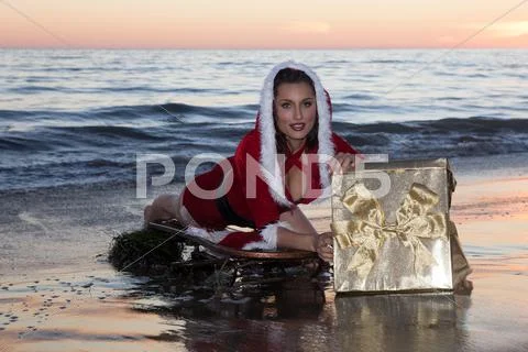 Attractive woman in Santa Claus costume Stock Photos
