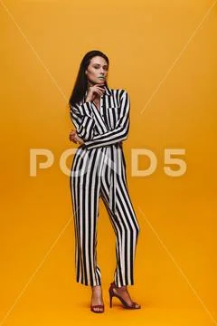 Attractive woman in striped jumpsuit Stock Photos