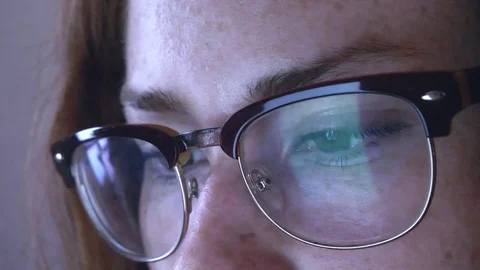 Attractive woman tablet touchscreen reflection eye glasses closeup intellectual Stock Footage 77870960