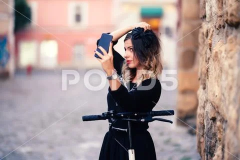 Attractive woman taking selfies with phone camera. Portrait of cheerful girl Stock Photos