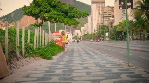 Attractive woman walking on sidewalk Stock Footage 59378318