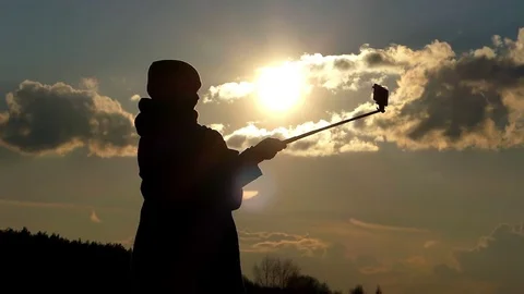Attractive Woman is Waving Her Hand and Making a Selfie Photo During an Stock Footage