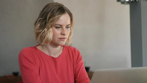 Attractive woman working on computer while drinking coffee Stock Footage 87567750