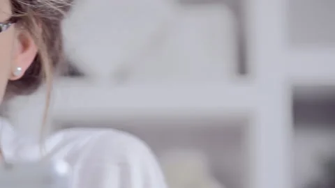 Attractive young blonde woman using tablet computer touchscreen. Video stock 199629792