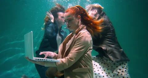 Attractive young concentrated red haired business woman using laptop to work Video stock 171882978