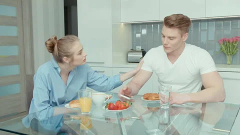 Attractive young couple arguing in the kitchen. Stock Footage 86716062