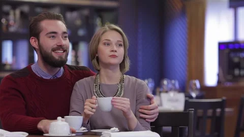 Attractive young couple in a cafe Stock Footage 252597891