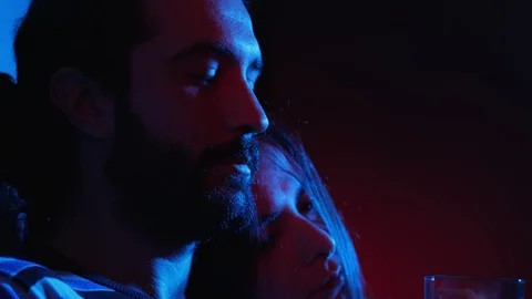 Attractive young couple in the dark drinking cocktail together.Flirt,sensuality 動画素材 103506932