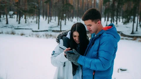 Attractive young couple use smart phone Stock Footage 86316148