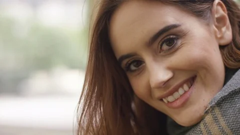 Attractive young female using a digital tablet outside and then smiles to camera 库存影片 80312013