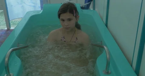Attractive young girl bathing in a bath ... | Stock Video | Pond5 