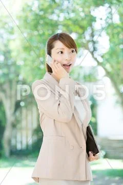 Attractive young girl with smartphone Stock Photos