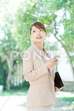 Attractive young girl with smartphone Stock Photos