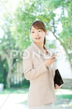 Attractive young girl with smartphone Stock Photos