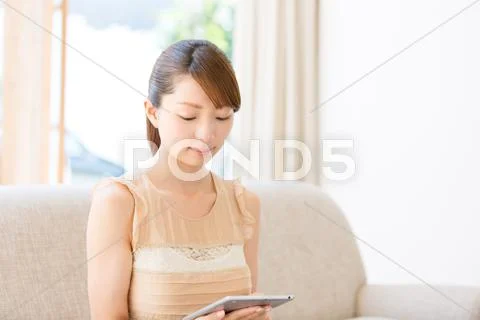 Attractive young girl with tablet Stock Photos