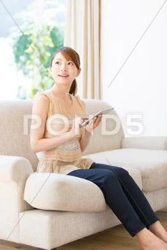 Attractive young girl with tablet Stock Photos