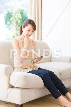 Attractive young girl with tablet Stock Photos