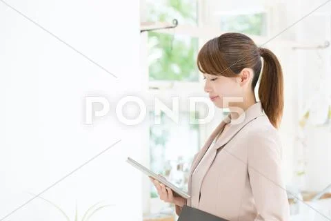 Attractive young girl with tablet Stock Photos