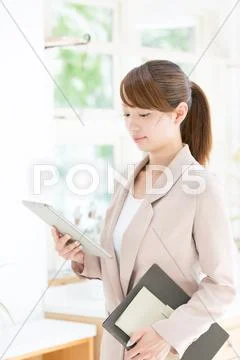 Attractive young girl with tablet Stock Photos
