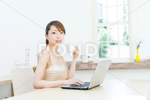 Attractive young girl working with laptop Stock Photos
