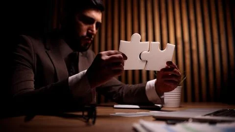 Attractive young guy is solving a problem 库存照片