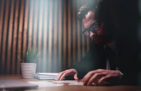 Attractive young guy is solving a problem 写真素材