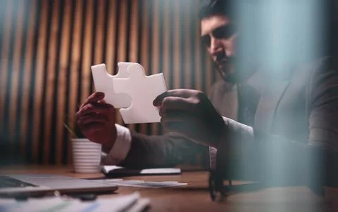 Attractive young guy is solving a problem 库存照片