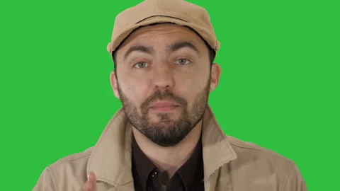 Attractive young guy talking to you Focus, think about it on a Green Screen Vídeo Stock 100570973