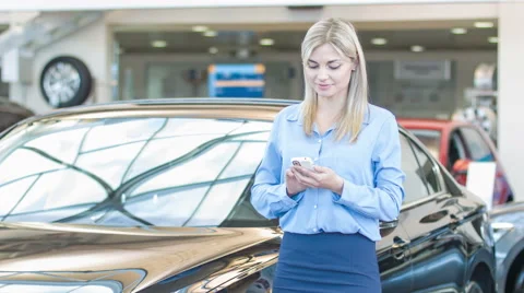 Attractive young lady is texting on her smartphone Stock Footage 58729029