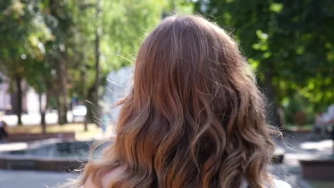 Attractive young lady turns to camera and searching for someone. Stock Footage 157054909